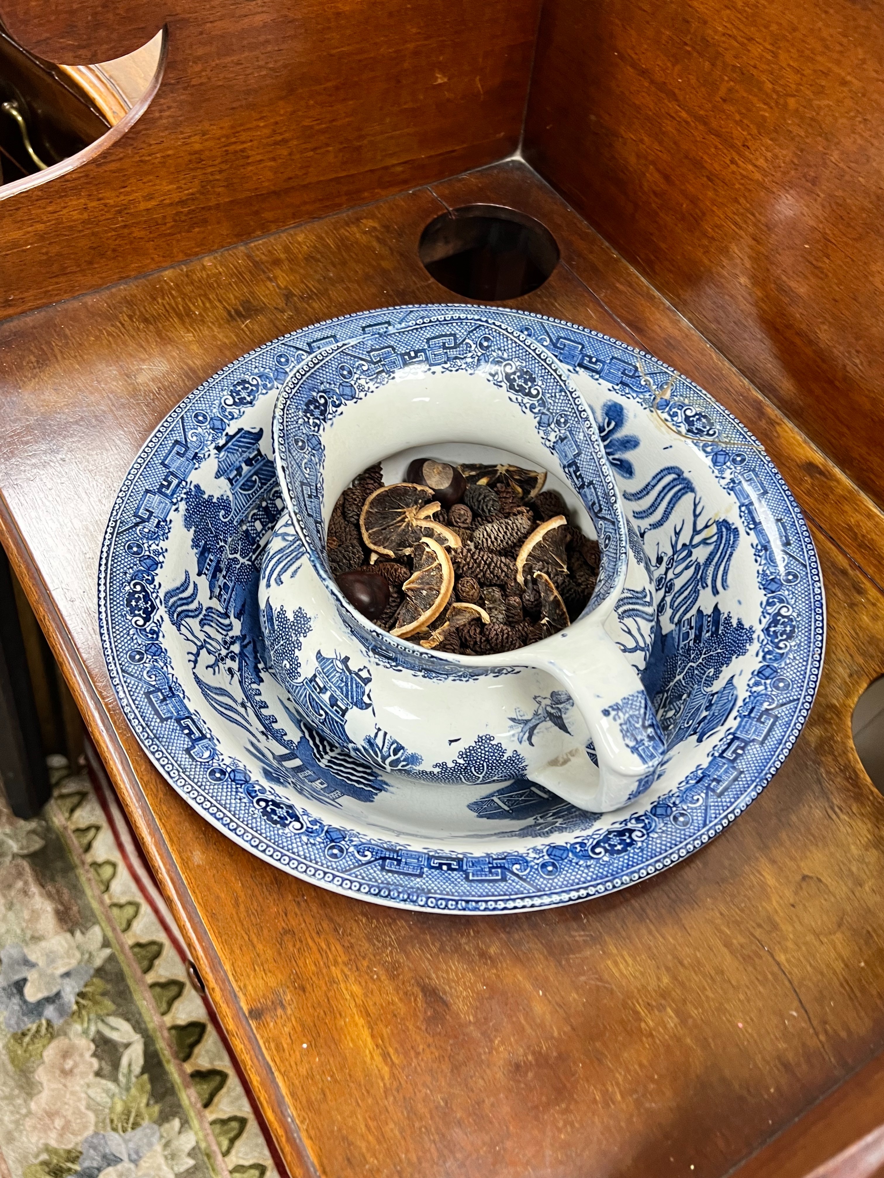 A Regency mahogany two tier washstand, together with a Staffordshire blue and white jug and basin, width 50cm depth 38cm height 101cm